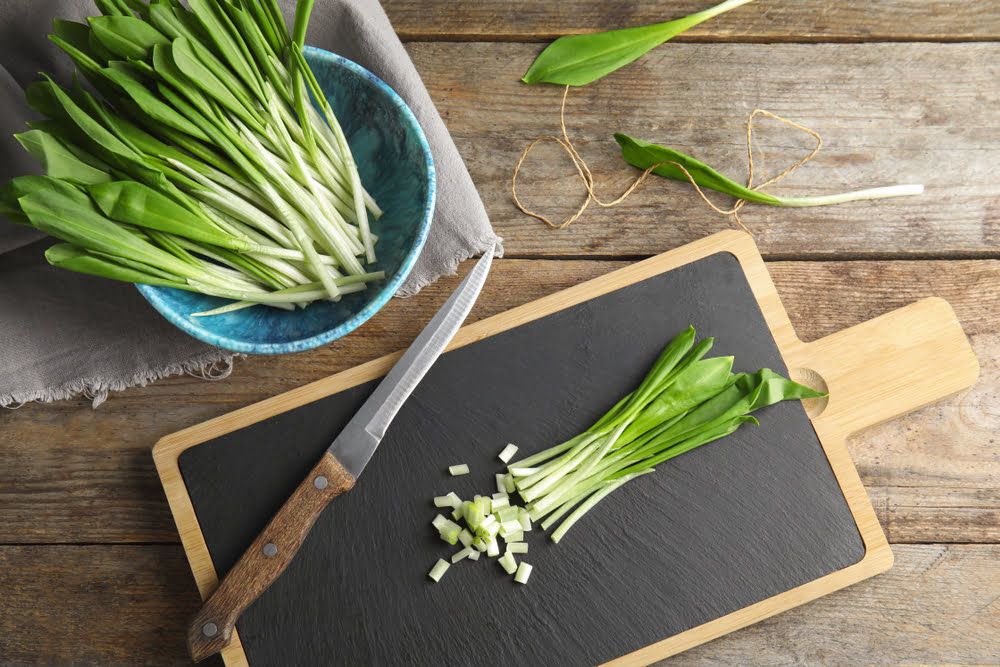Wild garlic leaves on chopping board