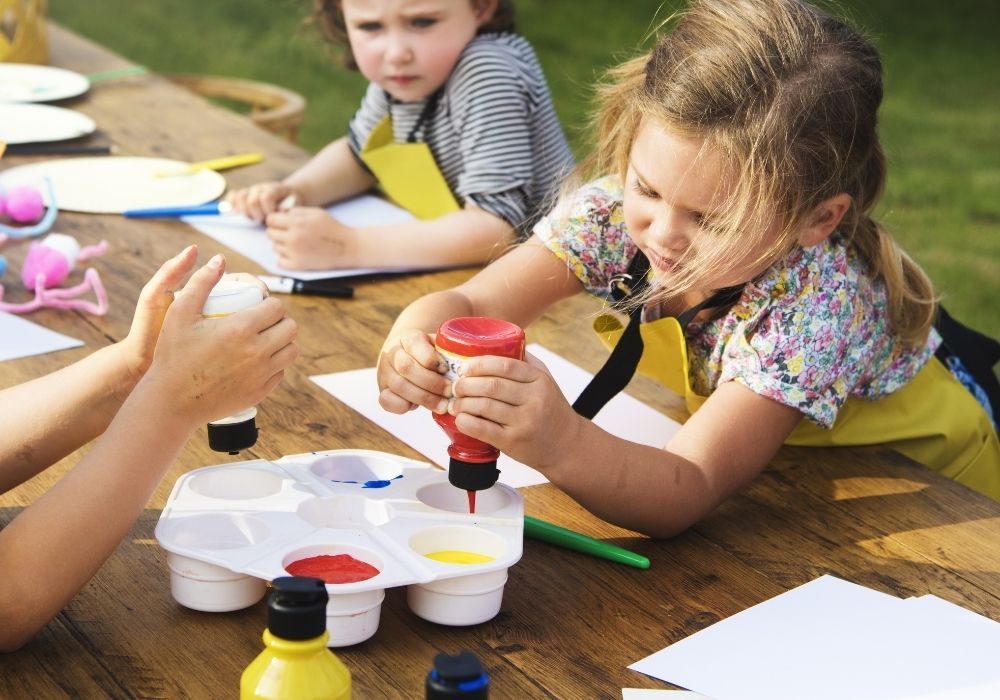 children-painting-outdoor-school-garden
