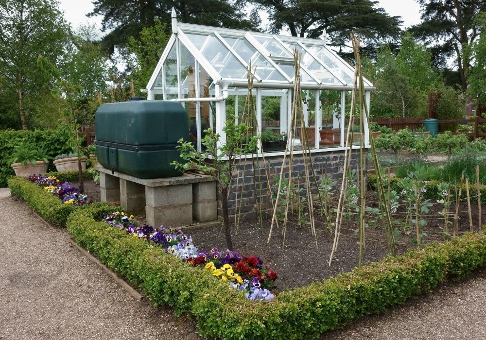 small-greenhouse-with-water-tank