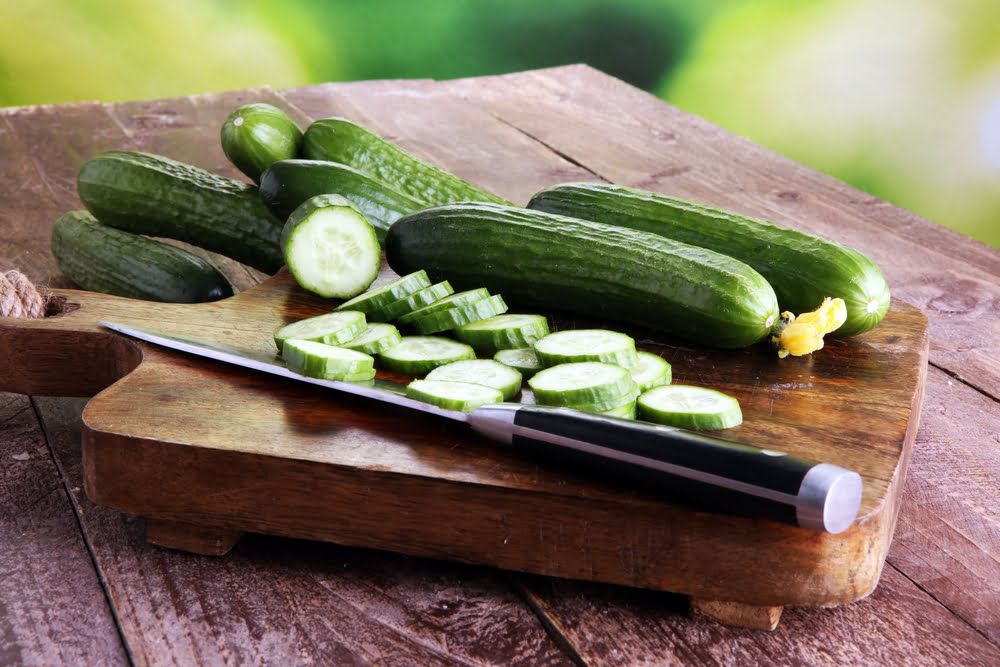 Cucumbers sliced on chopping board