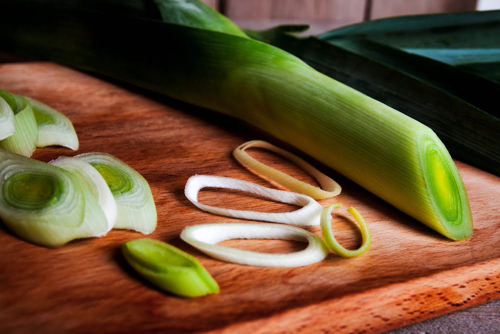 Sliced leek on chopping board