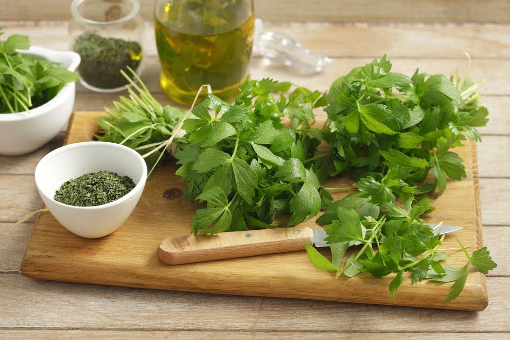 Lovage on chopping board