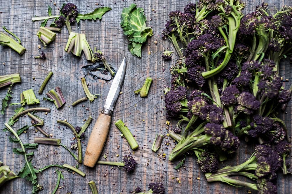 Purple Sprouting Broccoli pieces and knife