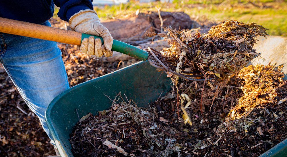 Person adding amendments to soil