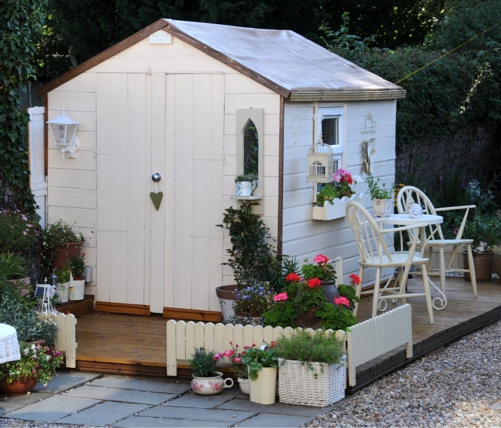 white-garden-shed-with-plants